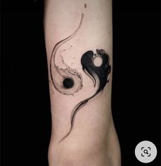 a black and white tattoo on the arm