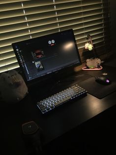 a desktop computer sitting on top of a wooden desk next to a mouse and keyboard