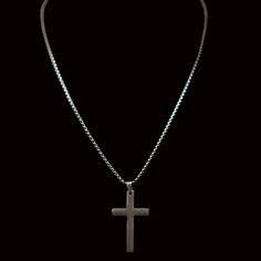 This sleek crucifix pendant suspended from a substantial stainless-steel chain makes a bold, modern statement. Its weighty feel and solid metal construction give it a rugged, spunky vibe, perfect for the guy who wants classic style with an edgy twist. Wear it solo for the modern minimalist look, or layer it with other necklaces for an urban edge. When it comes to men's necklaces, stainless steel offers strength, shine, and street cred. Stainless Steel necklaces interlock metal rings, discs, or b Metal Cross Necklace With Chain, Metal Cross Pendant Necklace With Chain, Black Metal Cross Chain Necklace, Metal Cross Necklace With Chain Pendant, Stainless Steel Silver Cross Chain Necklace, Stainless Steel Cross Chain Necklace With Adjustable Chain, Minimalist Stainless Steel Cross Necklace With Adjustable Chain, Crucifix Cross Necklace With Box Chain, Stainless Steel Cross Pendant Chain Necklace