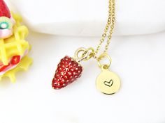 This is a gold-tone strawberry charm with hand stamped initial charm on a stainless steel chain. Tarnish Resistant! ♥ You will receive 1 necklace ♥ Alloy Enamel Pendants, Lead- Nickel Free, Size: about: 17x9x8mm ♥ Initial Disc Long-Lasting Plated, Real 18K Gold Deep Plated, Nickel Free, Flat Round, 8-10mm. **conversion : 1 inch = 25.4mm or 1mm = 0.0393 inch** ♥ All personalization is done by HAND. ♥ Raw materials the USA and international sourcing. ♥ Handcrafted with Love&Care by hands in Go Dainty Red Personalized Charm Necklaces, Dainty Personalized Red Charm Necklaces, Gold Hand Stamped Charm Necklace For Valentine's Day, Personalized Red Round Pendant Charm Necklaces, Peanuts Charm, Customize Jewelry, Enamel Pendants, Strawberry Necklace, Strawberry Charm