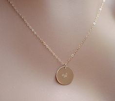 "Gold Initial Necklace Monogram Personalized 14k gold filled Elegant and simple ~ this Gold disc is handmade and stamped with Initial & Font of your choice or can fit a short name or date! DETAILS Quality 14k Gold Filled thick 20 gauge disc in 5/8ths inch (15mm) Double Clad (NOT plated) 14k Gold filled Delicate Cable Chain ~ you choose length at checkout . You choose Font and Initial ( name, date) whatever fits! *I have fonts in photo PLUS several others, Ariel/Block, New large DIVA font and Initial Fonts, Initial Disc Necklace, Gold Initial Necklace, Initial Name, Initial Necklace Gold, Gold Disc, Gold Initial, Layering Necklace, Name Necklace