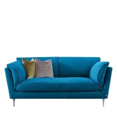 a blue couch with two pillows on it