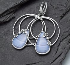 handmade earrings with Chalcedony natural Chalcedony big earrings with Chalcedony big, but not heavy patinated, polished material: silver Chalcedony from Namibia size of the earrings: 65 x 38,50 mm (2,567 × 1,522 inch) size of Chalcedony: 2,60 x 1,60 mm (1,028 x 0,635 inch) Elegant Silver Agate Earrings, Silver Agate Earrings With Natural Stones, Silver Agate Jewelry With Matching Earrings, Silver Bohemian Agate Earrings, Bohemian Silver Agate Earrings, Chalcedony Natural Stone Drop Earrings, Chalcedony Drop Earrings With Natural Stones, Nickel-free Silver Agate Earrings, Handmade Chalcedony Drop Earrings