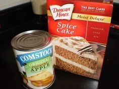 a can of cake next to a piece of cake with frosting and cinnamon apples