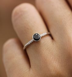 -Black Diamond in Bezel And Pave setting Ring ❮❮ Details ❯❯ ◆ Handmade in our Manhattan Studio. ◆ Center Stone : Diamond, Approx. 0.30-0.34ct ◆ Side Stones : Diamond, Approx. 1.1mm x 6stones − Diamond Color : F − Diamond Clarity : VS − Conflict-free ◆ Band Width : 1.50mm thickness, full round ◆ Material : 14K Yellow Gold,Rose Gold, White Gold. ◆ Sizes available : 3 - 9 (Pls send us convo for over size 9, Priced upon request) ✔︎ Make sure to add for your favorite ❤sign on the image. It would be h Classic Black Spinel Diamond Ring For Anniversary, Classic Black Spinel Promise Ring, Minimalist Black Round Band Ring, Black Solitaire Diamond Promise Ring, Elegant Black Ring With Single Diamond, Classic Black Diamond Ring With Round Band, Black Round Band Ring Fine Jewelry, Black Diamond Ring With Round Band, Fine Jewelry Black Round Band Ring