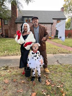 a man, woman and child dressed up in costumes