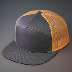 A Cotton Twill, Mesh Backed Blank 7 Panel Hat with a Flat Bill, & Classic Snapback. A mash up of our 5 panel camp fit & our Wooly Trucker, The Magnificent 7 features a clean cut & sew 7 panel construction that blends two vastly different styles into one uniquely wearable piece. With a flat bill, mesh back & classic snapback these bad boys are perfect for any occasion. Custom The Magnificent 7 Panel Trucker Hat in Gold | Twill | Apparel | Headwear | Baseball Caps Luxury Formal Flat Bill Hats, Luxury Six-panel Hats For Streetwear, Luxury Flat Bill Hat For Fall, Luxury Classic Flat Bill Hat, Luxury Adjustable Baseball Cap With Curved Bill, Luxury Elegant Flat Bill Hat, Luxury Fall Flat Bill Hats, Luxury Six-panel Streetwear Hats, Magnificent 7