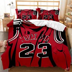 a bed with a red and black basketball jersey on it