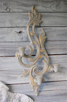 Large shabby chic triple candle wall sconce. Hand painted in soft grey and accented in gold with a protective coating. Manufactured by Syroco in the 1950's, of Syroco Wood.The sconce holds 3 taper candles and has a hanger on the back. 21.25" tall, 10.25" wide and 3.25" deep All orders placed before 5 p.m. EST will ship the following business day. >More> Candle Holders & Lamps Candle Sconces Living Room Wall Decor, Country Lamps, Painted Wood Walls, Sconces Living Room, Crystal Wall Lighting, Bathroom Candles, Shell Candles, Antique Candles, Candle Wall