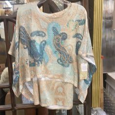 Pretty Design And Colors Beige One Size Casual Top, One Size Brown Tops For Beach, One Size Blue Tops For Fall, Bohemian Beige Top One Size, Spring Blue Tops One Size, Bohemian Beige One Size Tops, Blue Casual Tops One Size, Blue One Size Tops For Vacation, Spring Cream One Size Tops