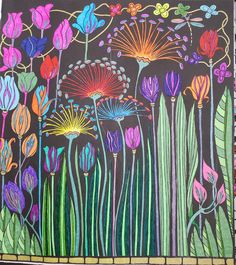 a drawing of colorful flowers and grass on a blackboard with colored chalk pastels