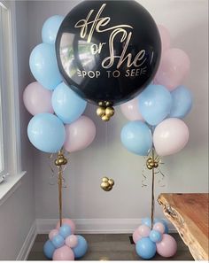 balloons and streamers with the words he or she pop to see