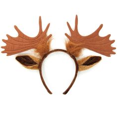 a pair of antlers with brown leaves on their ears are shown against a white background