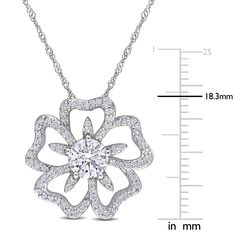 A floral for all seasons, this moissanite flower necklace refreshes your look, crafted in sterling silver. A gaze-grabbing single round lab-created moissanite centers an open moissanite-paved flower blooming with vibrant details and not so subtle dazzle. Naturally found in meteorites, lab-created moissanite gemstones are ultra-resilient with a disco-ball light effect that provides unparalleled sparkle. The total diamond equivalent weight is approximately 1 1/10 carats. | Moissanite Flower Neckla Diamond White Jewelry With Flower Shape And Diamond Accents, Silver Solitaire Necklace With Flower Pendant, Silver Diamond Necklace With Flower Accents, Diamond White Flower Pendant Necklace With Prong Setting, Silver Diamond Necklace With Flower Design, Diamond Cut Flower Jewelry In Diamond White, Flower Pendant With Cubic Zirconia In Prong Setting, Flower Pendant Jewelry With Prong Setting In Cubic Zirconia, Diamond White Flower-shaped Jewelry With Diamond Cut