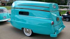 the top of this 1950 camper is a boat shaped body, and it's painted blue