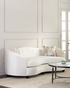 a white couch and table in a room