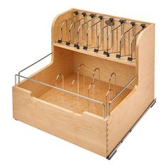 a wooden box with several glasses in it and an open drawer on the bottom that holds two pairs of scissors