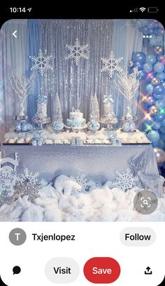 an image of a table set up with snowflakes and balloons on the table