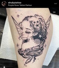 a tattoo on the leg of a woman