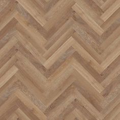 an image of wood flooring that looks like chevroned herringbones in light brown