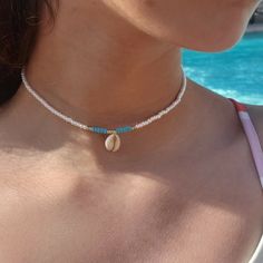 This Shell Choker Is Perfect For A Day At The Beach Or The Pool! Includes The Cutest Pukkajewels Shell To Add Some Beachy Vibes :)) Note!! Please Do Not Wear Or Submerge Necklace In Water!! It Could Potentially Fade/Rust Metals! Measures 13 ½" :)) Made With Stretchy String And Lobster Clasp For Some Extra Strength! Don't Be Shy To Send Me A Message For Any Custom Requests Or Modifications!! <33 Currently Only Shipping In Us Coastal Granddaughter Beaded Jewelry, Surfer Necklace Aesthetic, Beaded Beach Necklaces, Surf Jewelry Necklaces, Beachy Chokers, Shell Bead Necklace, Beachy Necklaces Beads, Blue Beach Jewelry, Beachy Beaded Jewelry