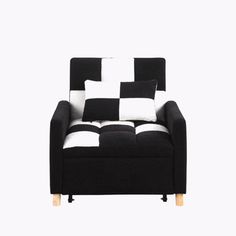 a black and white checkered chair with pillows on it's armrests