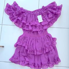 Never Worn, Tags Still On - Adorable Yet Sexy Magenta Dress. Detailed With Layered Ruffles And A Band Around The Waist To Enhance Your Curves. Fitted Purple Ruffle Dress For Party, Chic Mauve Dress With Ruffles, Fitted Purple Dress With Ruffle Hem, Fitted Purple Dresses With Ruffles, Purple Ruffle Dresses For Summer, Purple Ruffle Hem Dress For Date Night, Summer Purple Dress With Ruffles, Fitted Purple Ruffle Dress With Ruffle Hem, Elegant Purple Dress With Ruffled Skirt