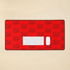 a computer mouse pad with a red skull pattern on it