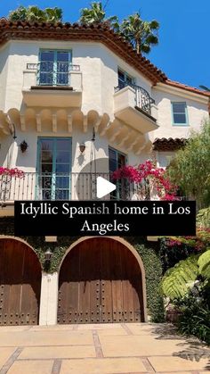 an apartment building with two garages and the words idyllic spanish home in los angeles