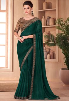 Faux Georgette Brasso Saree in Dark Teal Green Enhanced with Resham and Sequins Work Available with a Semi-stitched Art Silk and Net Blouse in Brown. Crafted in Round Neck and Half Sleeve Do note: Accessories shown in the image are for presentation purposes only. (Slight variation in actual color vs. image is possible). Satin Sari, Green Sarees, Saree Green, Sarees Silk, Dark Wedding, Lehenga Choli Online, Satin Saree, Green Saree, Art Silk Sarees