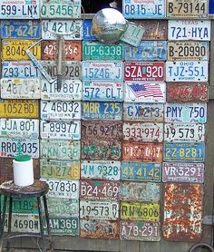 an assortment of license plates are stacked on top of each other