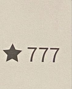 an airplane flying in the sky with a star on it's side and number 777