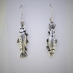 "For the fisherman / fisherwoman...these steelhead earrings are super realistic and highly detailed. Solid sterling silver earrings and lever back ear wires. Designed and manufactured by me in my studio. I hand carved the original wax model and did the casting and finishing to bring these superb steelhead earrings to the world! -fish are about 1 1/8 \" long -solid sterling silver - hyper realistic -steelhead are a highly prized game fish in the northwest gift boxed" Silver Fish-shaped Earrings With Ear Wire, Nickel-free Silver Fish-shaped Earrings, Silver Fish-shaped Earrings With Fish Hooks, Silver Sterling Fish-shaped Earrings, Silver Fish-shaped Sterling Silver Earrings, Fish Earing, Fish Earrings, Whimsical Fashion, Funky Jewelry