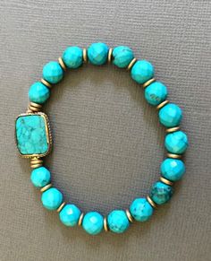 "Turquoise Beaded Bracelet accented with natural brass. Perfect gift for Loved ones or yourself. *Large rectangular Turquoise beads measures approx. 17mm x 14mm *Turquoise Bead measures approx. 8mm **If given a turquoise by a loving friend, that stone would protect the wearer from negative energy and bring good fortune. The turquoise is the symbol of friendship. It also brings peace to the home. This lovely bracelet will come to you or your special someone in a nice gift box. ------------------- Turquoise Stretch Bracelet With Natural Stones For Gift, Turquoise Stretch Bracelet With Natural Stones As Gift, Bohemian Turquoise Howlite Bracelets, Handmade Adjustable Turquoise Stretch Bracelet, Turquoise Gemstone Beads Stretch Bracelet As Gift, Turquoise Stretch Bracelet With Gemstone Beads As Gift, Bohemian Stackable Beaded Bracelets In Turquoise, Stackable Bohemian Turquoise Beaded Bracelets, Bohemian Turquoise Stackable Beaded Bracelets