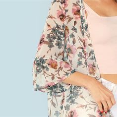 This lovely floral kimono is sure to be a new fave in your wardrobe. This kimono features ruffled 3/4 sleeves and has a billowy form. Pairs perfectly with pants, jeans, skirts, shorts and leggings. Made with a polyester blend for comfort and style. Short Dresses Party, Kimono Online, Women Kimono, Casual Kimono, Short Bodycon Dress, Ruffle Fabric, Womens Kimono, Long Kimono, Floral Kimono