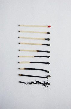 black and white photograph of various brushes on top of each other