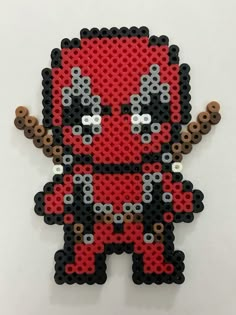 the deadpool is made out of legos and has been placed on a wall