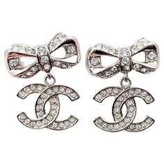 New In Boxchanel Crystal Bow Drop Earrings In Silver. Vintage And In Pristine Condition! Selling On 1stdibs For $999 Chanel Silver Ribbon Cc Dangle Crystal Piercing Earrings *Marked 18 *Made In Italy *Comes With Original Box And Pouch Vintage 2010s Collection Approximately 0.75" X 0.6" Dimensions Height: 0.75 In (19.05 Mm) Width: 0.6 In (15.24 Mm) Piercing Earrings, Silver Ribbon, Chanel Jewelry, Earrings Silver, Original Box, Silver Tone, In Italy, Chanel, Ribbon