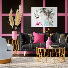 a living room with pink, black and gold decor on the walls next to a couch