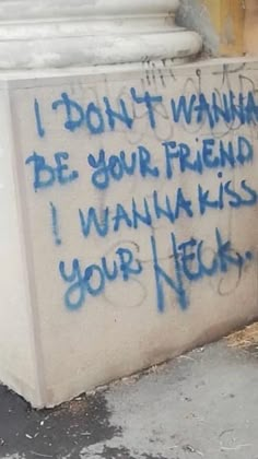 graffiti written on the side of a building in front of a white pillar with blue writing that says i don't wanna be your friend