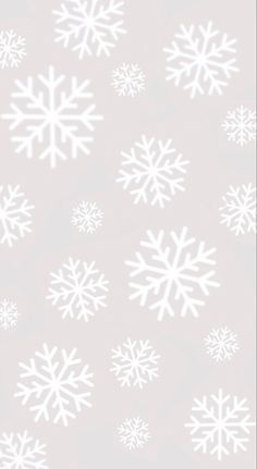 white snowflakes on a light gray background