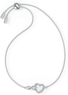 This heart bracelet combines the precision and quality of sparkling crystals with a chic rhodium plated chain, making this endearing look a cute accessory. A single white crystal adorns a dainty infinity sign interlaced with a dazzling white crystal pave heart, adding a brilliant and romantic touch to the simple, refined design.