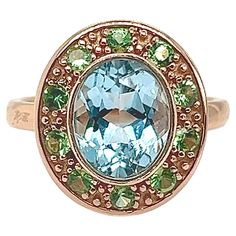 This sumptuous 18-carat gold ring is set with 10 tsavorite stones and a magnificent topaz. Each piece is unique due to the natural topaz stone, whose color nuances and details may vary from one creation to the next. Initially available in size 54, our Mesure et Art du Temps workshops can adjust it perfectly to your size. Elegant and refined, this ring enhances any outfit with a touch of timeless sophistication. Let yourself be seduced by the luxury and brilliance of this exceptional piece, a tes Luxury Vintage Diamond Topaz Ring, Luxury Antique Topaz Ring, E.t Art, African Black Soap, Black Soap, Topaz Stone, Vintage Engagement, Belleza Natural, Antique Rings