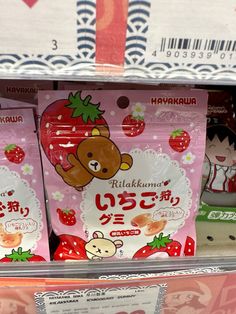 two bags of strawberry flavored gummy bears on display in a store's shelf