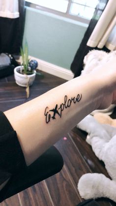 a person with a tattoo on their arm that says fatflove in black ink