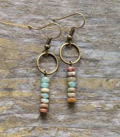 Vintage Natural Stone EarringsJasper is an opaque and dense variety of Quartz. Its energy is slow, consistent, and aligned with the energies of the plant enabling one to be more present in the physical body. Jasper is an elemental earth stone found all around the world. The unique artistry of Jasper is that of nature itself. Its earthy tones resemble golden sunshine, a midnight sky, deep green forests, desert sands, the ocean, red rock canyons, and smokey mountains. Jasper reminds us that while Earrings With Beads, Stone Dangle Earrings, Jasper Earrings, Bracelets Diy, Beaded Hoop Earrings, Diy Schmuck, Circle Earrings, Diy Earrings, Bohemian Jewelry