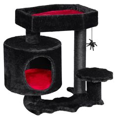 the cat tree is black and red with a spider hanging from it's side