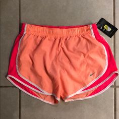 Nike Dry Fit Shorts. Size Medium. New With Tags!! Pink And Orange/Coral Color. Small Mark On The Back (Pictured), Never Worn So Not Sure What It Is Or If It Will Come Out! Pink Sports Shorts For Spring, Pink Bottoms For Gym In Summer, Pink Summer Gym Bottoms, Pink Gym Shorts For Spring, Pink Athletic Shorts For Spring Workout, Spring Pink Shorts For Gym, Summer Sports Pink Bottoms, Pink Summer Sports Bottoms, Pink Sports Bottoms For Spring