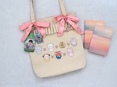 a bag with pictures on it next to a card