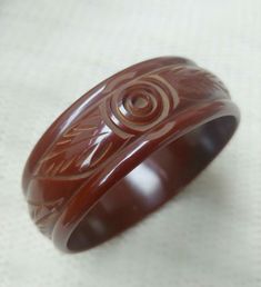 Vintage Chocolate Brown Carved Bakelite Catalin Bangle Bracelet TESTED Elegant Cheap Brown Bangle, Mid-century Bangle Bracelets As Gifts, Mid-century Bangle Bracelet For Gift, Vintage Red Round Bangle, Vintage Bakelite Bracelet, Vintage Bakelite Bangle Jewelry, Vintage Bakelite Bangle, Vintage Handmade Red Bangle, Carved Red Vintage Jewelry